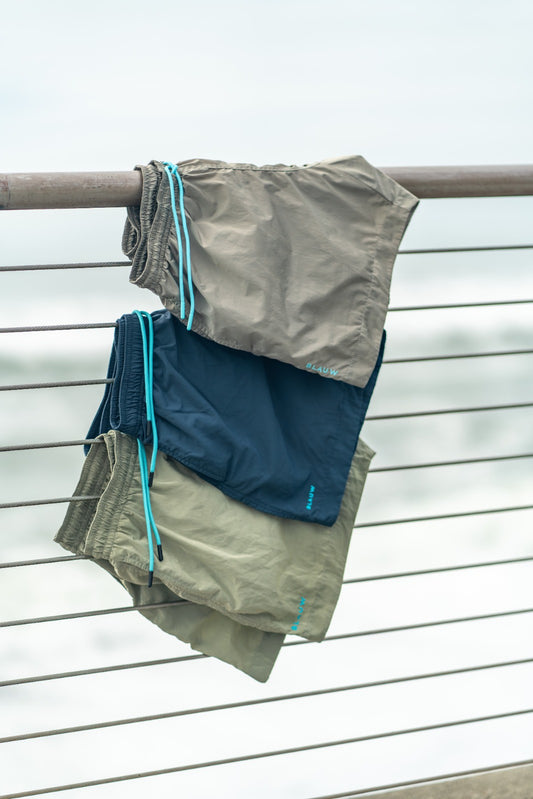 Recycled swim shorts drying on a railing. Made from ocean plastic.